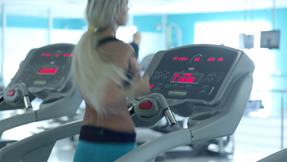 Woman Running in the Gym