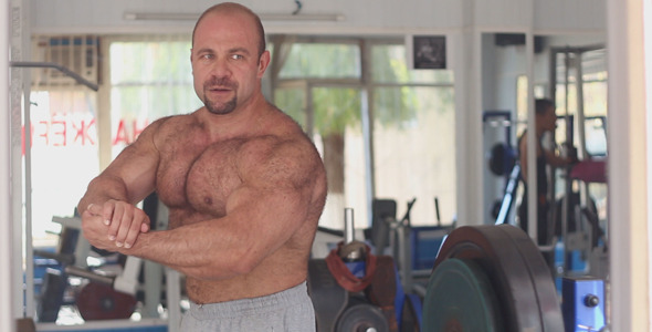 An Athlete Posing in Front of a Mirror