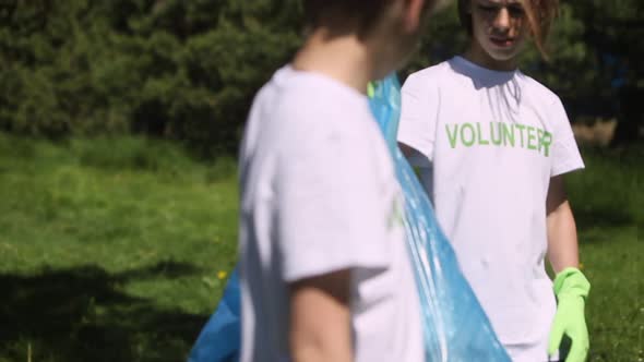 Children Boy Kid Volunteer Tshirt Tidying Up Garbage Bag in Park Spbi Cleaning Up Forest Plastic