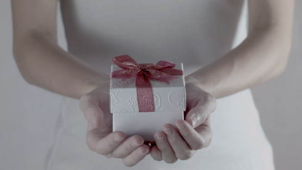 Hands With White Gift Box