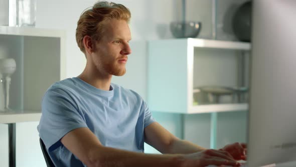 Smiling IT Manager Typing Keyboard at Closeup