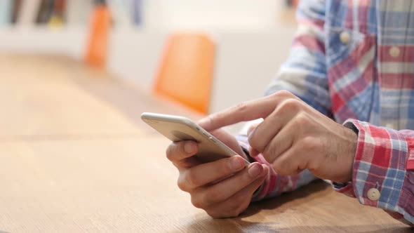 Close Up of Hand Using Smartphone