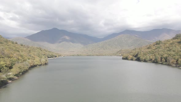 Aerial view of Kvareli lake between autumn forest, Georgia