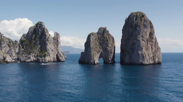 Rock Natural Archway of the Capri Faraglioni Sea Stacks in Italy - Aerial