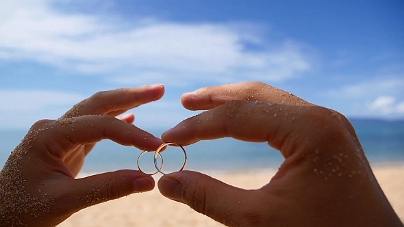 Wedding Rings against Sea