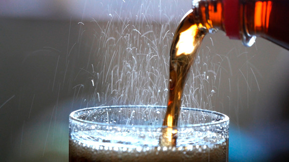 Pouring Coke Into Glass