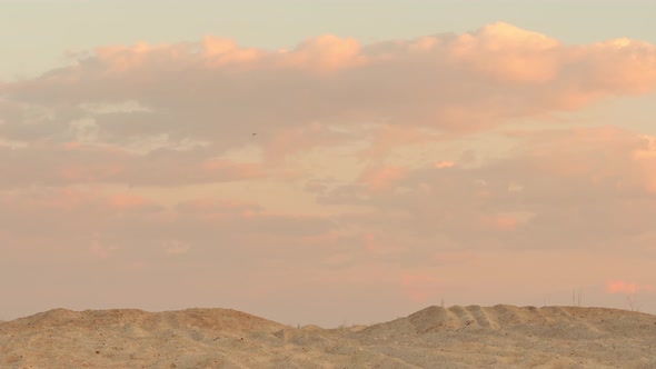 Сlouds at Sunset Over the Sand Desert