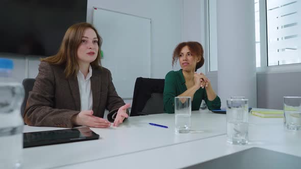 Business Women Having Meeting in Office