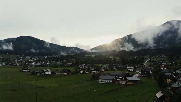 Panoramic View of a Picturesque Mountain Valley with a Village in a Lowland