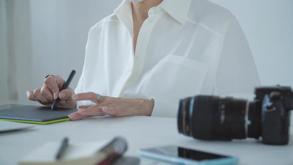 Creative Work and Hobby Concept Middleaged Woman Photo Editor Working on Computer at Her Desk with