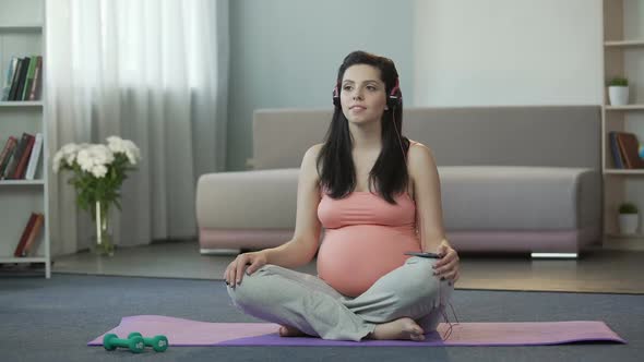 Pregnant Girl Listening to Melodies Engaging in Spiritual Development of Fetus
