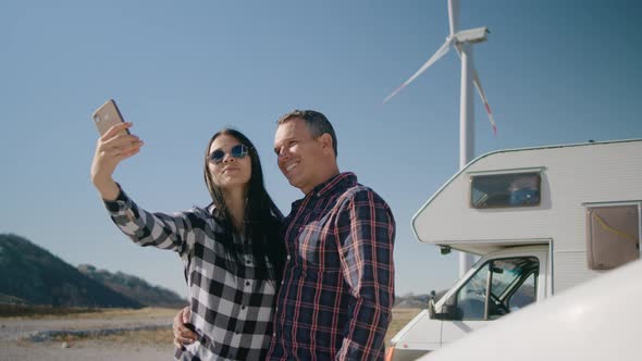 Couple Take Selfie on Motorhome Road Trip Outdoor