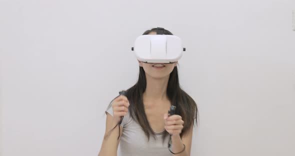 Excited Woman play game with VR device