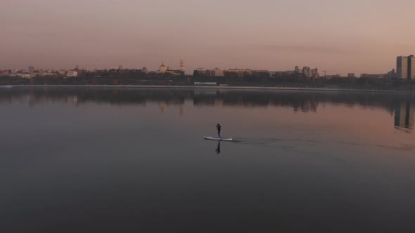 Surfer Swims Background City Panorama