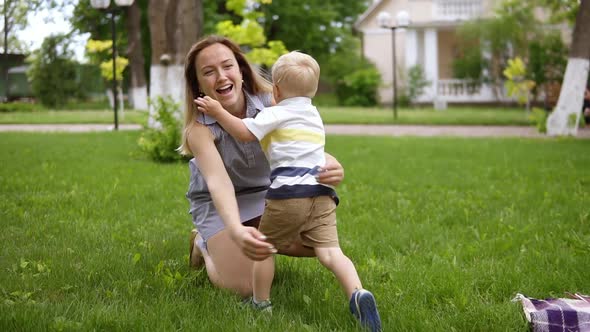 Little Blond Boy Running to His Mother