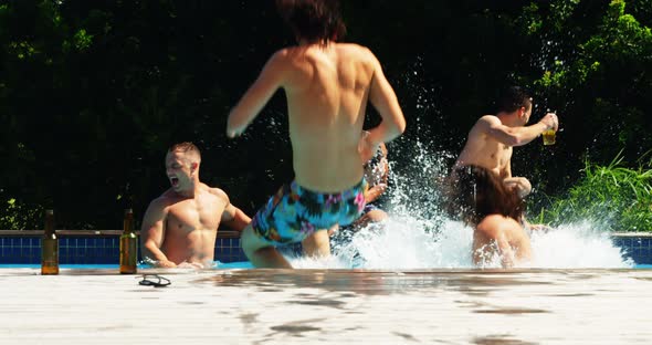Friends jumping in the swimming pool