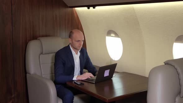 Young Businessman Working Using a Computer Laptop Doing Business flying