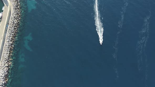 Aerial view of a boat sailing in Capo d'Enfola, Elba Island, Tuscany, Italy.