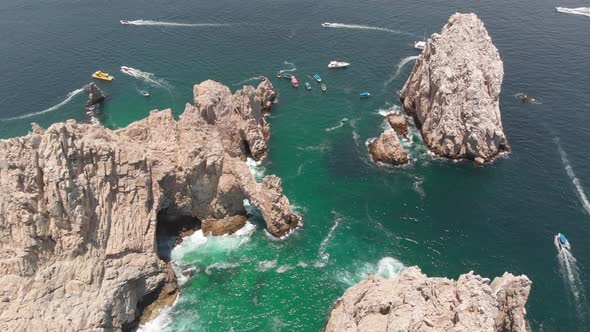 Aerial View of Rock Formation and Arch in Ocean