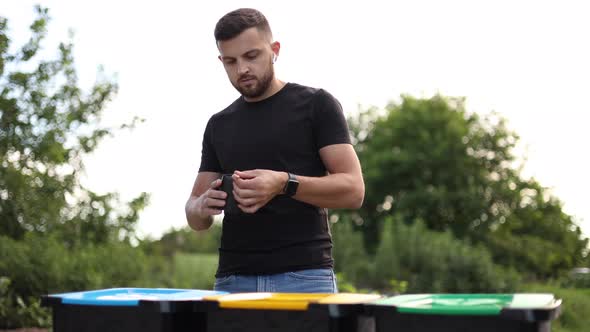 Man Throwing Out in the Recycling Disposable Food Container