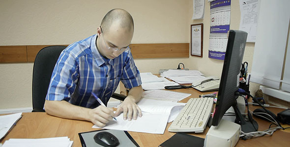 Office Worker Signing Documents