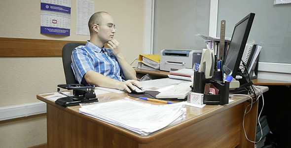 Office Worker Works With Computer alt