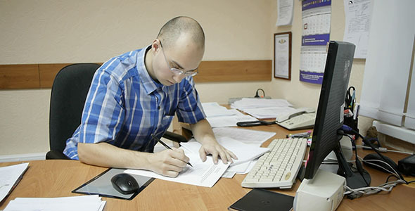 Office Worker Works With Diagrams  alt