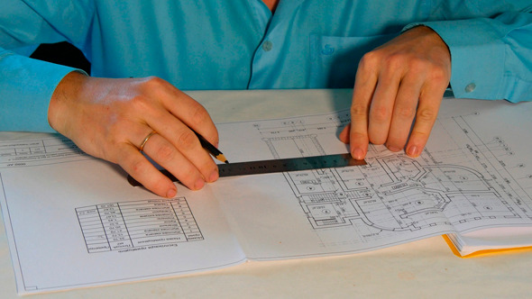 Architect Working With Blueprint