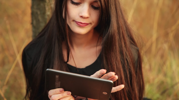 Girl Works With The Tablet