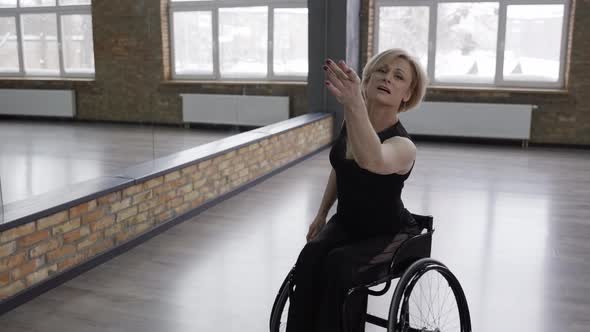 Disabled Female Dancer Whirling on Wheelchair