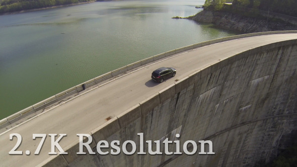 Flying over Car on Hydroelectric Dam