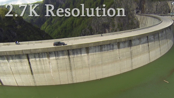 Flying over Car on Hydroelectric Dam 3