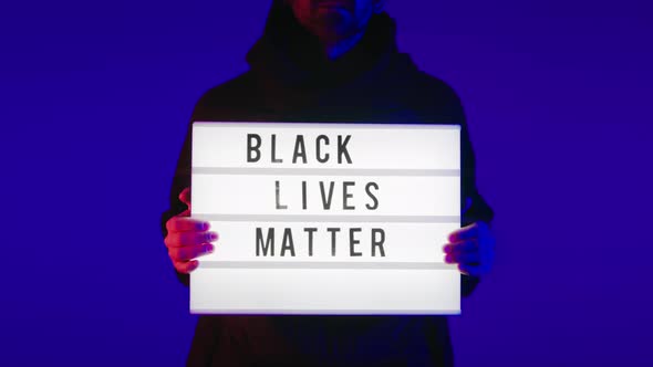 Man Holds a Political Sign Black Lives Matter