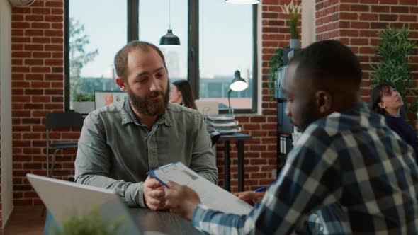 Diverse Group of Men Attending Job Interview to Discuss Hiring