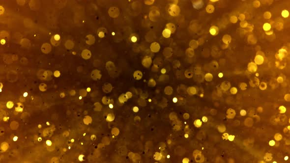 Super Slow Motion Shot of Golden Glitter Background at 1000Fps