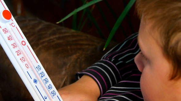 Boy Looking Indoor Thermometer