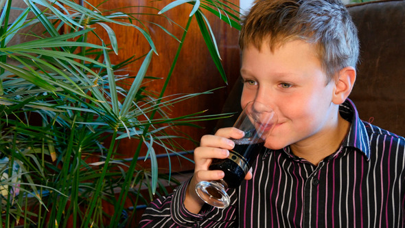 Young Boy Drinking Soda