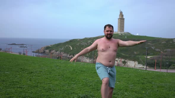 An Overweight Man is Engaged in Sports in Nature
