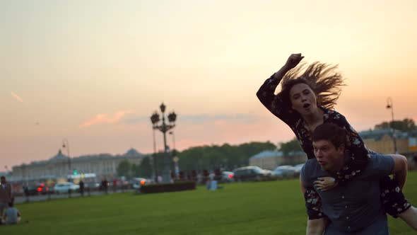 Happy Couple Playing in the Summer Field