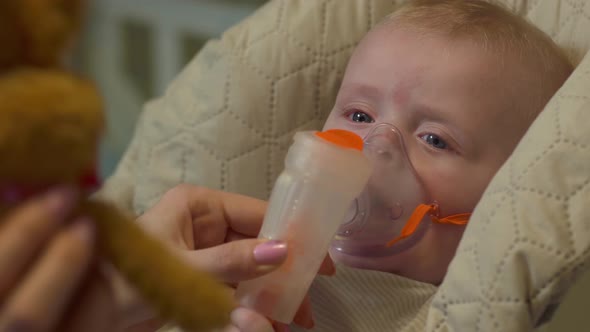 The Baby In Oxygen Mask