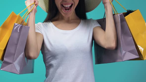 Emotional Girl in Hat Holding Shopping Bags, Supermarket Holiday Discounts