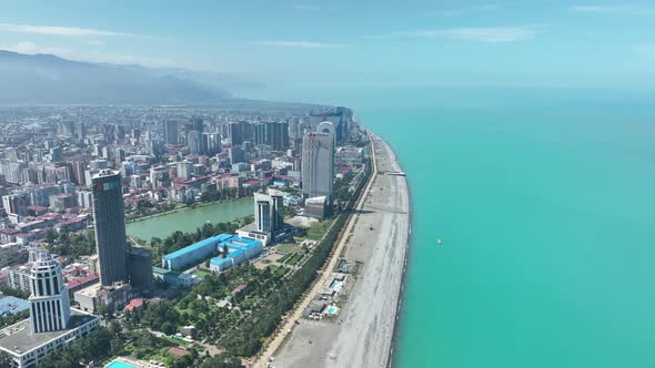 Aerial view of beautiful lake in the center of Batumi. flying over 6 May park. Georgia 2022 summer