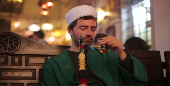 Islamic Man With Traditional Dress Smoking Shisha 