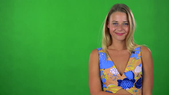 Young Pretty Blond Woman Agrees (Shakes with Head) - Green Screen - Studio