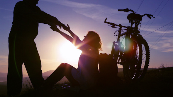 Couple in Love on a Hilltop Admire the Sunrise 3