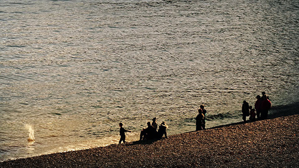 Children Play By Sea With Families