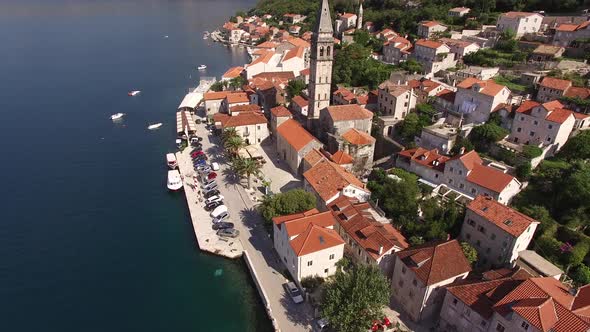 Aerial View of the Ancient Houses and the Bell Tower of Perast on the Embankment