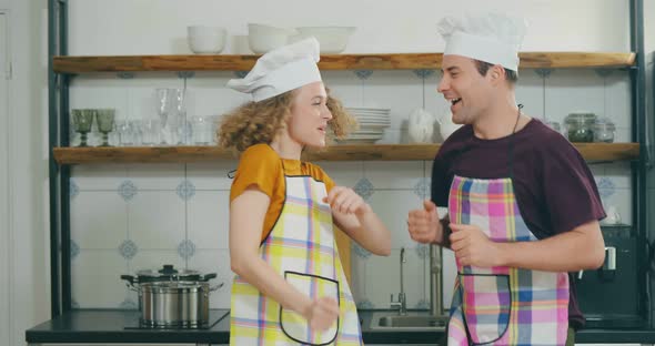 Happy and Carefree Couple in Kitchen