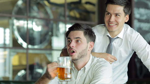 Three Friends Sitting At The Bar And Keep The Beer