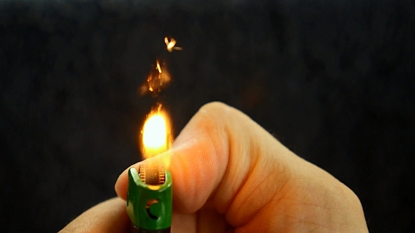 Gas Lighter in Male Hand